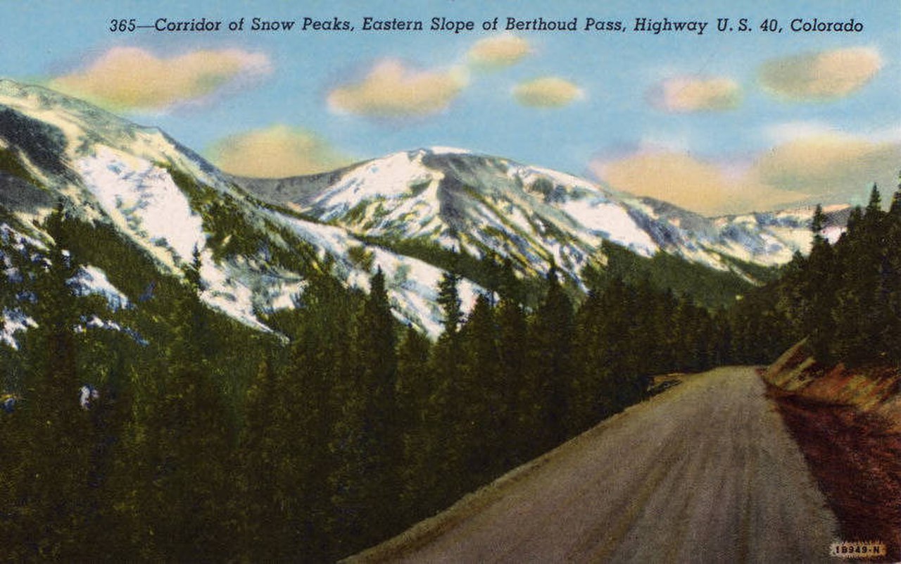 Vintage 1941 postcard view of U.S. Highway 40 climbing the snow-flanked eastern slope of Berthoud Pass, Colorado.