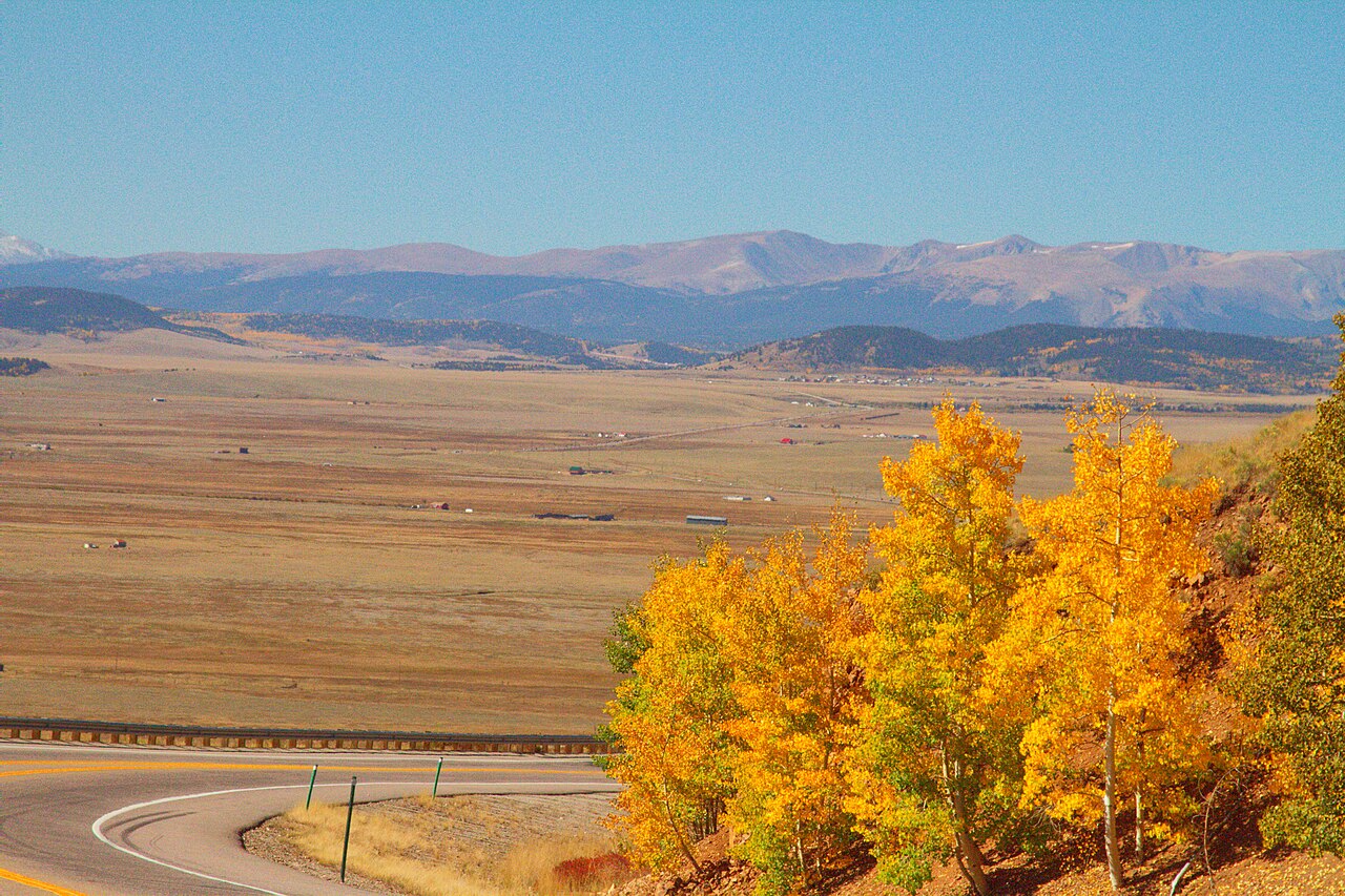 An autumn vista of the South Park valley seen from the summit of Kenosha Pass on US-285 in Colorado.