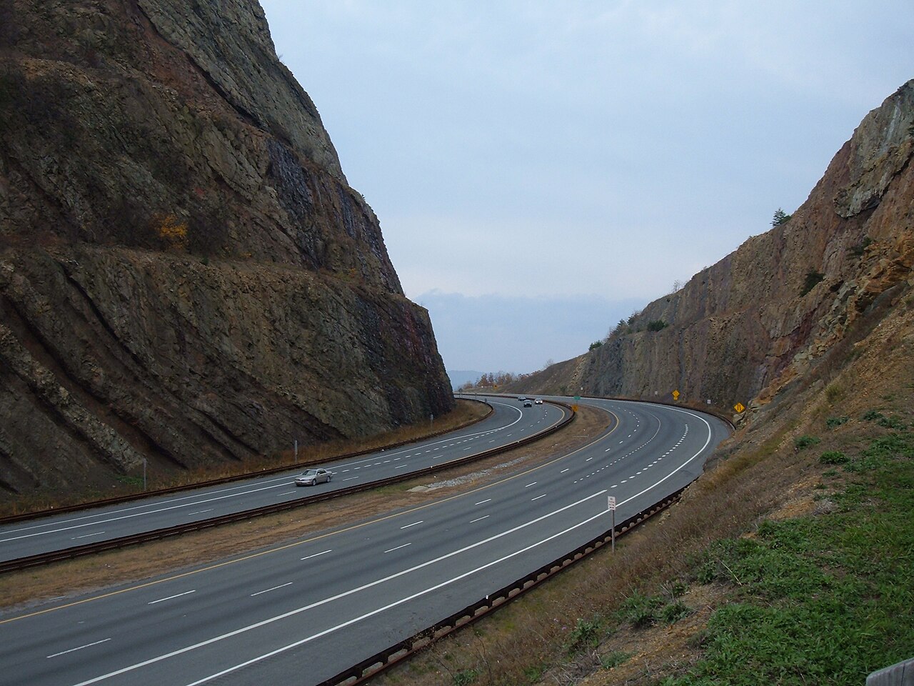 Interstate 68 sweeps through the Sideling Hill road cut near Hancock, Maryland, where the highway slices through the exposed folded rock of the ridge.